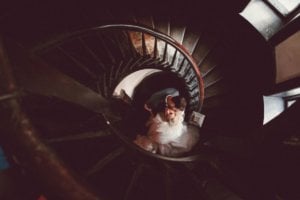Creative wedding portrait inside spiral staircase by Atlanta wedding photographers Brian + Lindsey