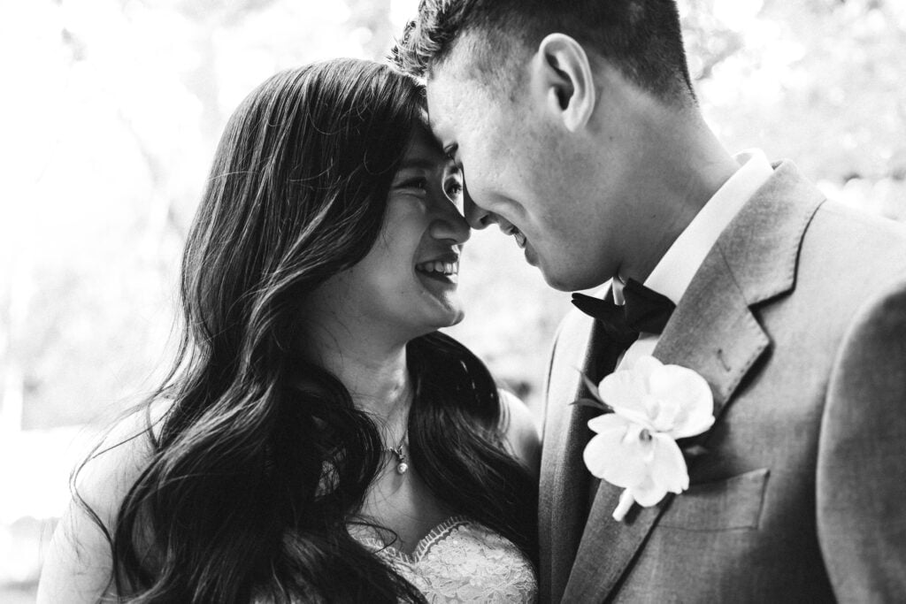 Black and white wedding portrait of Atlanta couple during emotional wedding photography moment by Brian + Lindsey Photography